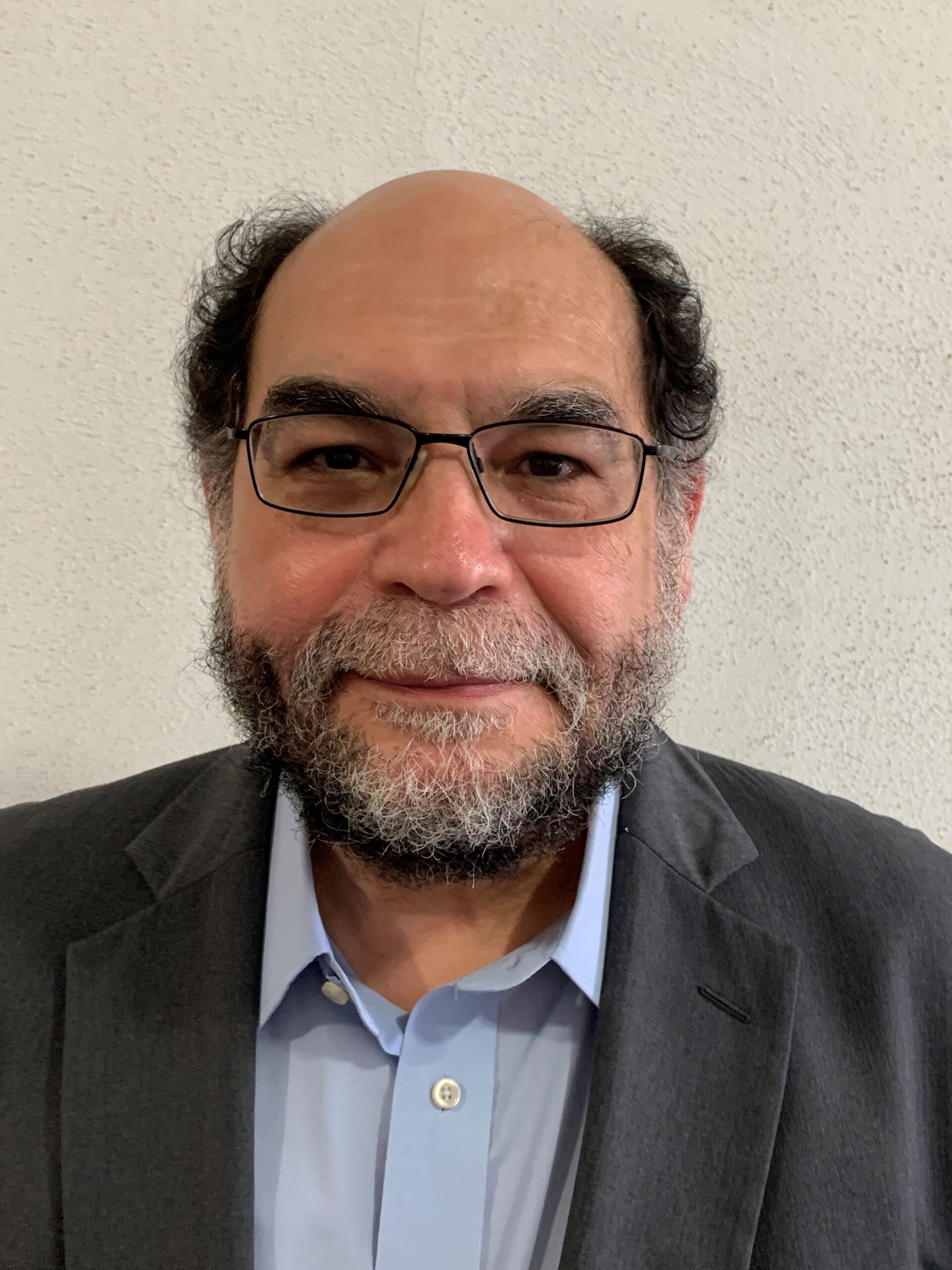 Headshot of demographer and sociologist Rogelio Saenz